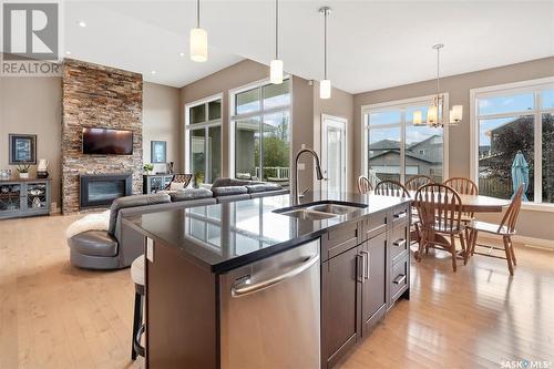 115 Johns Road, Saskatoon, SK - Indoor Photo Showing Kitchen With Fireplace With Double Sink With Upgraded Kitchen