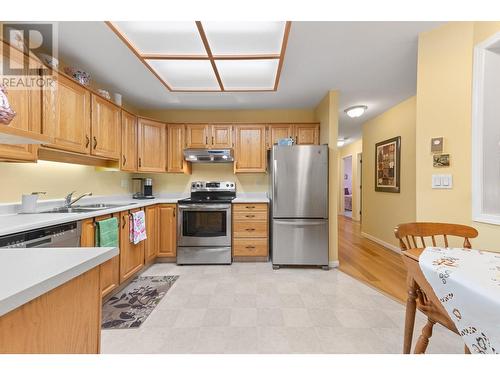 945 Lawrence Avenue Unit# 104, Kelowna, BC - Indoor Photo Showing Kitchen With Double Sink