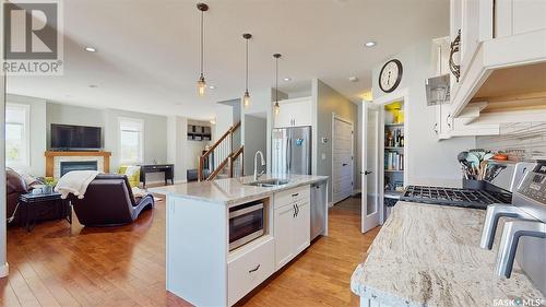 5102 Devine Drive, Regina, SK - Indoor Photo Showing Kitchen With Fireplace With Double Sink With Upgraded Kitchen