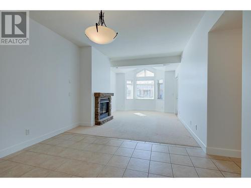 3996 Beach Avenue Unit# 313, Peachland, BC - Indoor Photo Showing Other Room With Fireplace