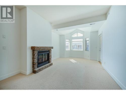 3996 Beach Avenue Unit# 313, Peachland, BC - Indoor With Fireplace