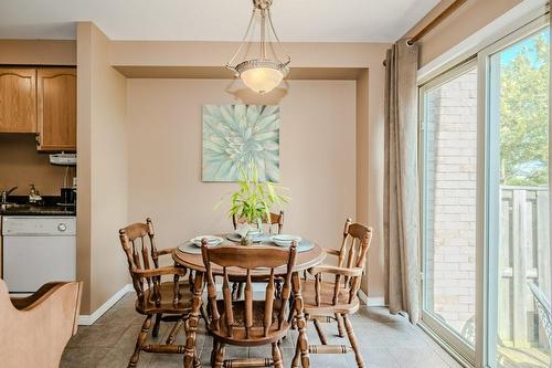 sliding door to back yard - 565 Rymal Road E|Unit #43, Hamilton, ON - Indoor Photo Showing Dining Room