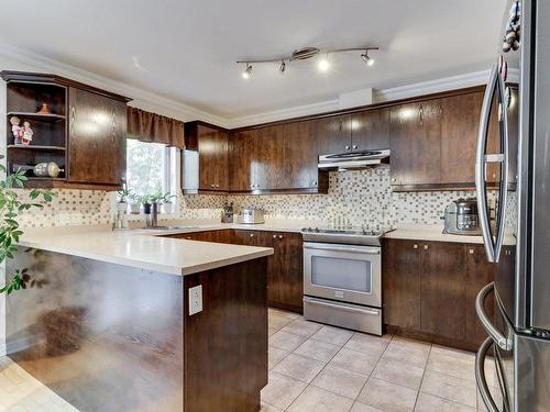 Cuisine - 7856 Rue Angèle, Laval (Duvernay), QC - Indoor Photo Showing Kitchen With Upgraded Kitchen