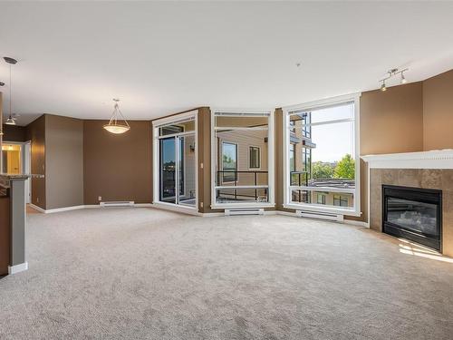 309-330 Waterfront Cres, Victoria, BC - Indoor Photo Showing Living Room With Fireplace