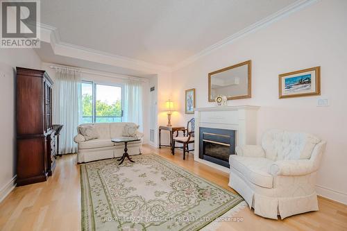 705 - 1 Lomond Drive, Toronto (Islington-City Centre West), ON - Indoor Photo Showing Living Room With Fireplace