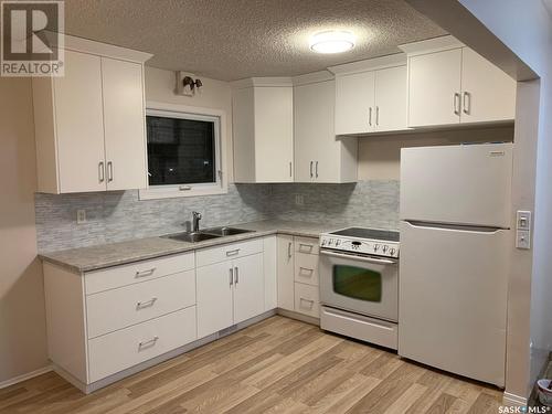 44 Campbell Place, Clavet, SK - Indoor Photo Showing Kitchen With Double Sink