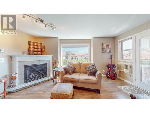 9307 62Nd Avenue Unit# 211, Osoyoos, BC - Indoor Photo Showing Living Room With Fireplace