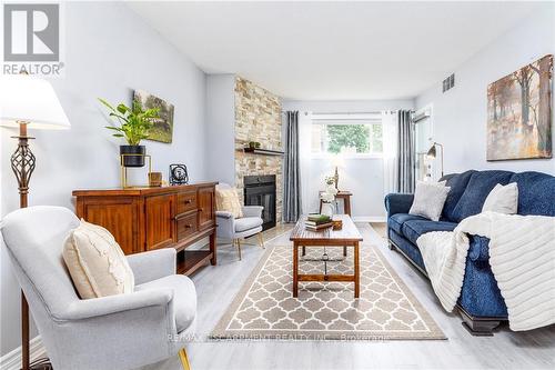 116 - 78 Roehampton Avenue, St. Catharines, ON - Indoor Photo Showing Living Room With Fireplace