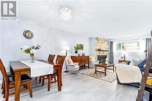 116 - 78 Roehampton Avenue, St. Catharines, ON - Indoor Photo Showing Dining Room With Fireplace