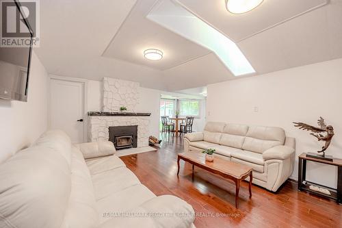 3923 Algonquin Avenue, Innisfil, ON - Indoor Photo Showing Living Room With Fireplace