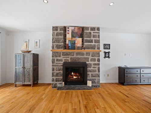 Living room - 46 Mtée De L'Église, Mille-Isles, QC - Indoor Photo Showing Living Room With Fireplace