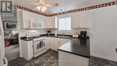 45 Elmdale Drive, Prince Edward County (Wellington), ON - Indoor Photo Showing Kitchen With Double Sink