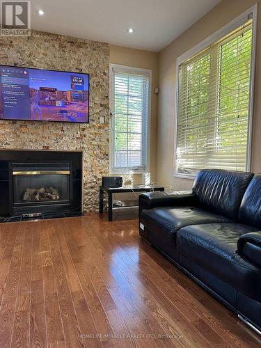 20 Latania Boulevard, Brampton, ON - Indoor Photo Showing Living Room With Fireplace