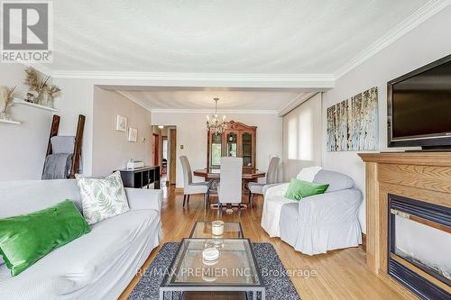 65 Allonsius Drive, Toronto, ON - Indoor Photo Showing Living Room With Fireplace