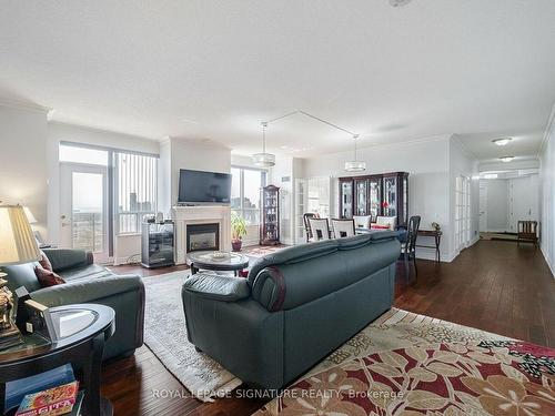 2808-25 Kingsbridge Garden Circ, Mississauga, ON - Indoor Photo Showing Living Room With Fireplace