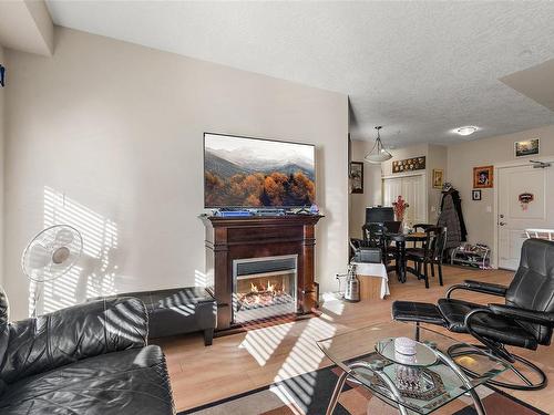 205-2220 Sooke Rd, Colwood, BC - Indoor Photo Showing Living Room With Fireplace