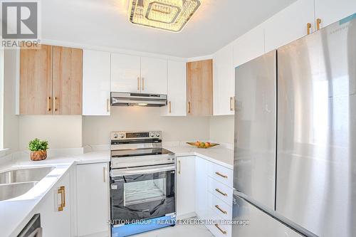 907 - 4235 Sherwoodtowne Boulevard, Mississauga, ON - Indoor Photo Showing Kitchen With Double Sink