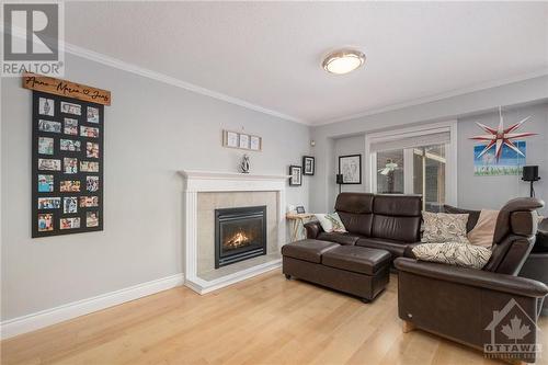 573 Apollo Way, Orleans, ON - Indoor Photo Showing Living Room With Fireplace