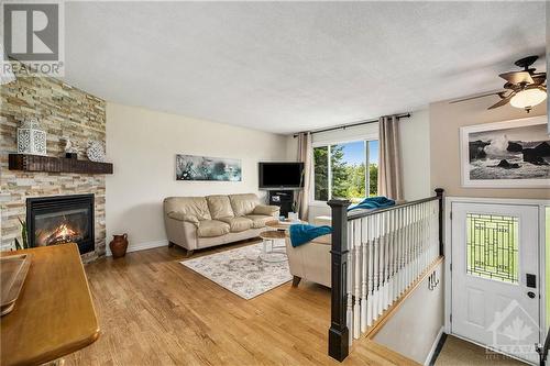 Hardwood floors and gas fireplace in living room - 1657 7Th Line Road, Carleton Place, ON - Indoor Photo Showing Living Room With Fireplace