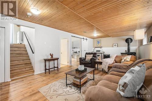 Wood stove in recreation room for cool nights - 1657 7Th Line Road, Carleton Place, ON - Indoor Photo Showing Living Room