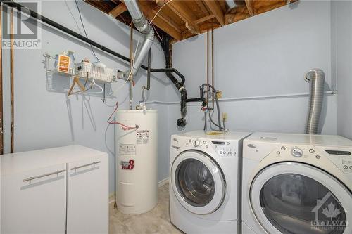 laundry room lower level with new owned hot water tank - 1657 7Th Line Road, Carleton Place, ON - Indoor Photo Showing Laundry Room