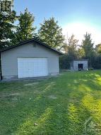 single oversized 20'X24' detached garage with 12' o/h door and wood shed - 