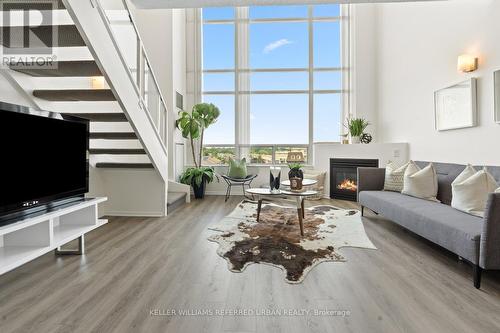 534 - 200 Manitoba Street, Toronto (Mimico), ON - Indoor Photo Showing Living Room With Fireplace