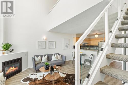 534 - 200 Manitoba Street, Toronto (Mimico), ON - Indoor Photo Showing Living Room With Fireplace