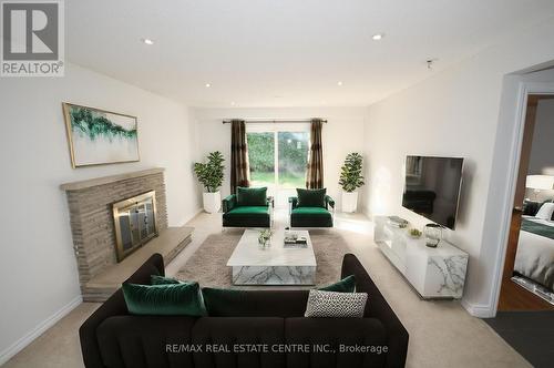 8 Governor Grove Crescent, Brampton, ON - Indoor Photo Showing Living Room With Fireplace