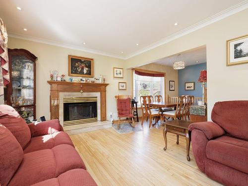 Living room - 1515 Place Carling, Dorval, QC - Indoor Photo Showing Living Room With Fireplace