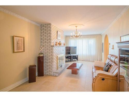 Family room - 3055 Rue St-Victor, Laval (Duvernay), QC - Indoor Photo Showing Living Room With Fireplace