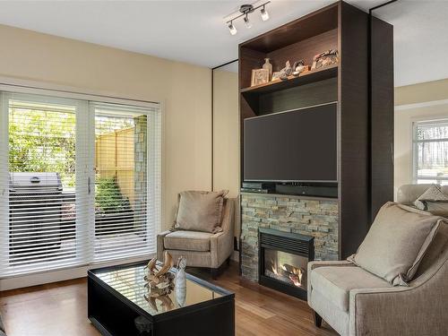 101-1400 Lynburne Pl, Langford, BC - Indoor Photo Showing Living Room With Fireplace