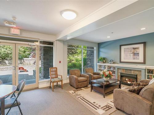 304-297 Hirst Ave, Parksville, BC - Indoor Photo Showing Living Room With Fireplace