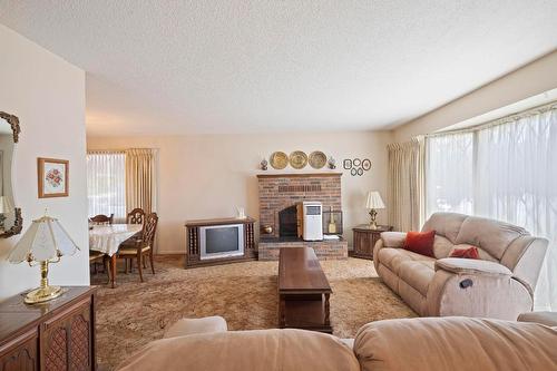 1770 High Road, Kelowna, BC - Indoor Photo Showing Living Room With Fireplace