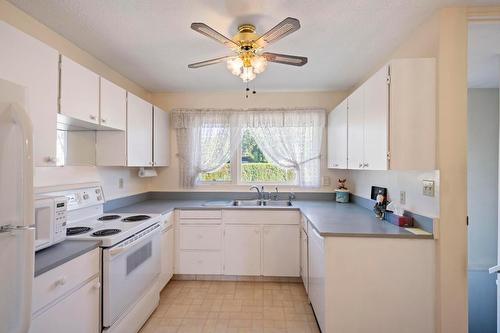 1770 High Road, Kelowna, BC - Indoor Photo Showing Kitchen With Double Sink