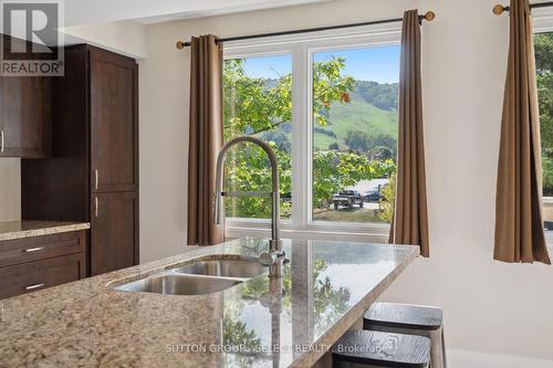 Mountain Views - 208 - 107 Wintergreen Place, Blue Mountains (Blue Mountain Resort Area), ON - Indoor Photo Showing Kitchen With Double Sink