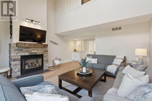 208 - 107 Wintergreen Place, Blue Mountains (Blue Mountain Resort Area), ON - Indoor Photo Showing Living Room With Fireplace