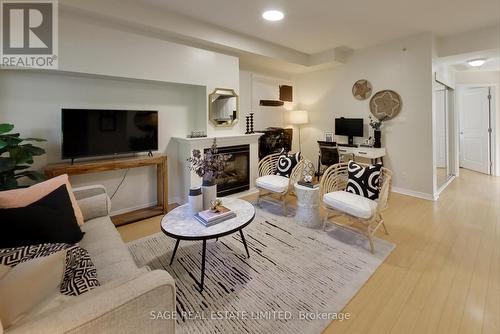 203 - 1785 Eglinton Avenue E, Toronto (Victoria Village), ON - Indoor Photo Showing Living Room With Fireplace