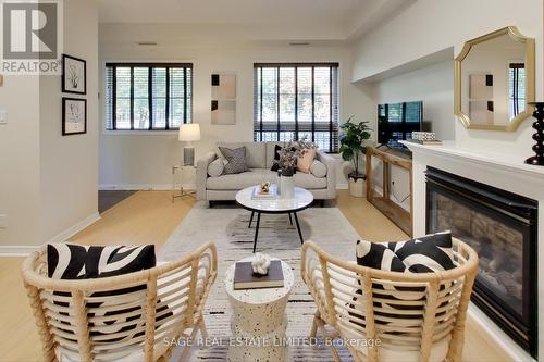 203 - 1785 Eglinton Avenue E, Toronto (Victoria Village), ON - Indoor Photo Showing Living Room With Fireplace