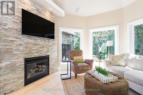 14 Lloyd Cook Drive W, Springwater (Minesing), ON - Indoor Photo Showing Living Room With Fireplace