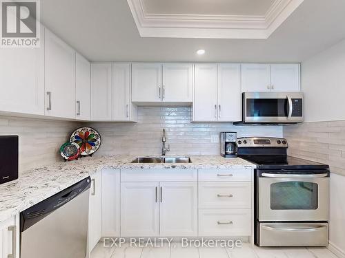 718 - 10 Dean Park Road, Toronto (Rouge), ON - Indoor Photo Showing Kitchen With Double Sink