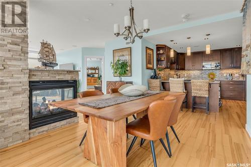 904 2300 Broad Street, Regina, SK - Indoor Photo Showing Dining Room With Fireplace