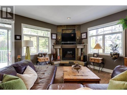 Gas fireplace in great room - 1831 Horizon Drive, West Kelowna, BC - Indoor Photo Showing Living Room With Fireplace