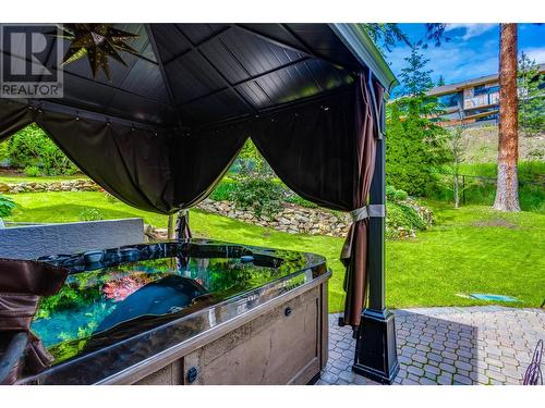 8 person hot tub walking out onto rear yard - 1831 Horizon Drive, West Kelowna, BC - Outdoor