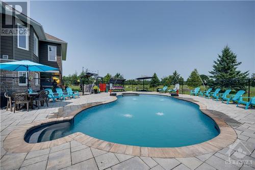 99 Muirfield Court, Ottawa, ON - Outdoor With In Ground Pool