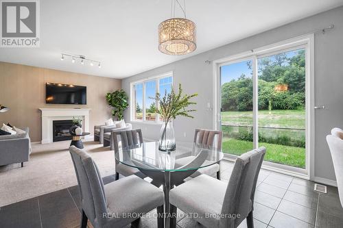 340 Falling Green Crescent, Kitchener, ON - Indoor Photo Showing Dining Room With Fireplace