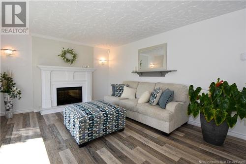 791 Saulnier Ouest, Canton Des Basques, NB - Indoor Photo Showing Living Room With Fireplace