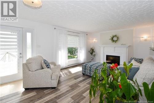 791 Saulnier Ouest, Canton Des Basques, NB - Indoor Photo Showing Living Room With Fireplace