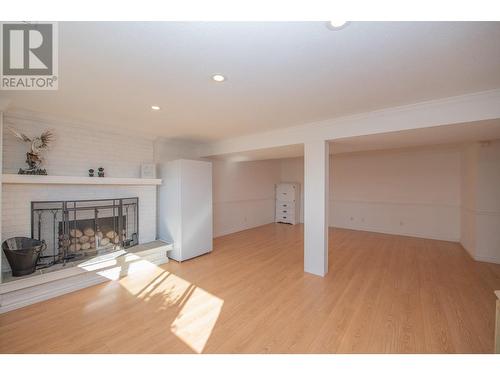 10781 Cheryl Road, Lake Country, BC - Indoor Photo Showing Other Room With Fireplace