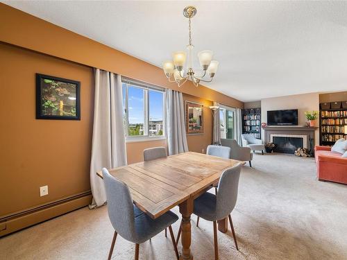 406-1188 Yates St, Victoria, BC - Indoor Photo Showing Dining Room With Fireplace